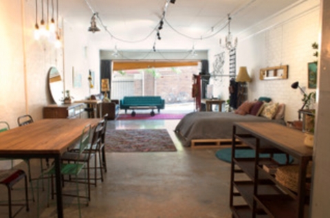 The Garage interior, bifold and roller doors open