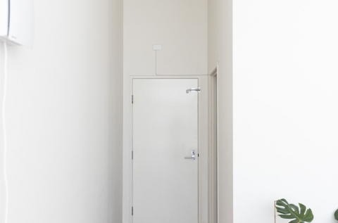 Hallway to bathroom and garage entry
